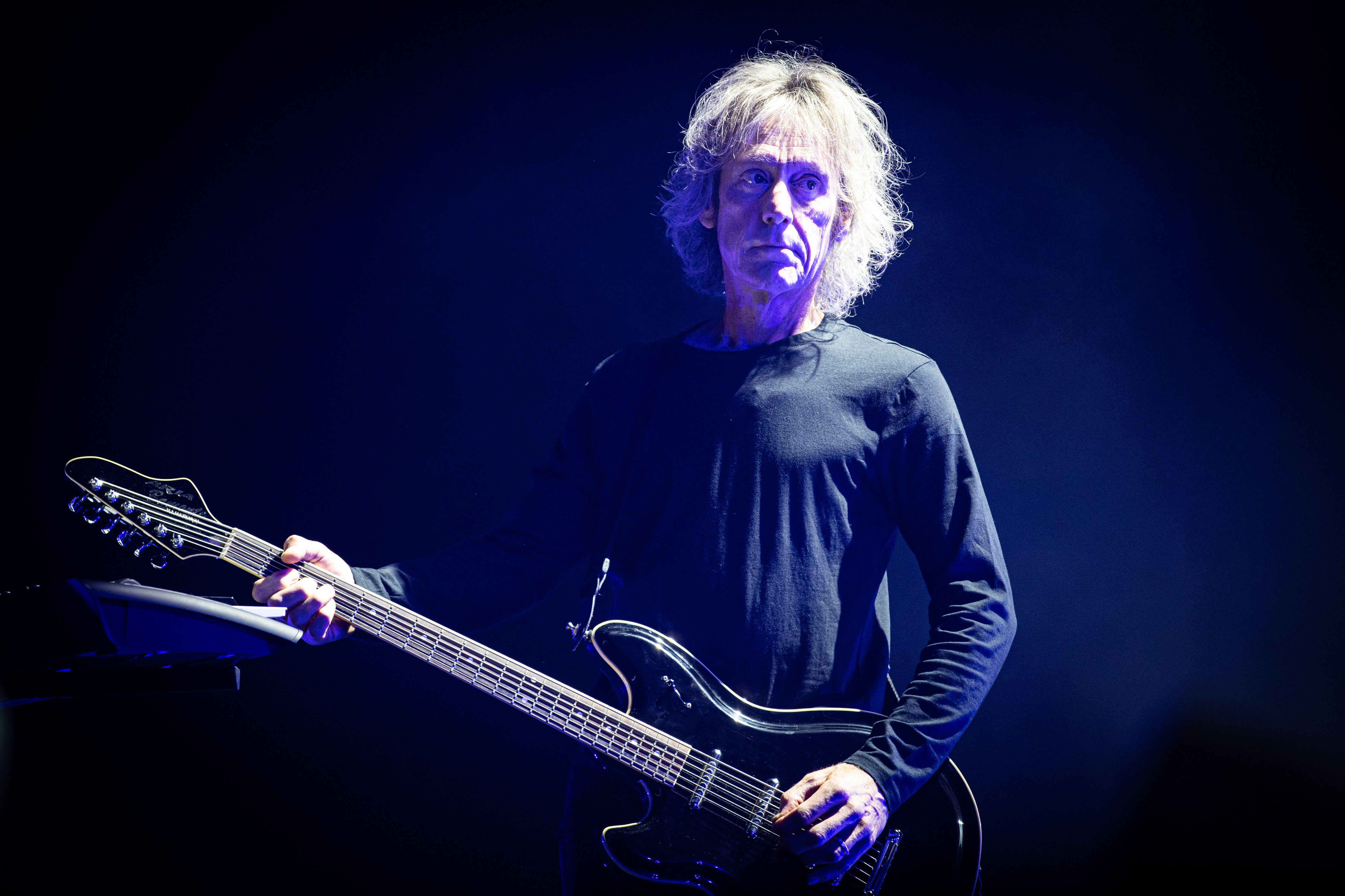 Perry Bamonte playing guitar for The Cure