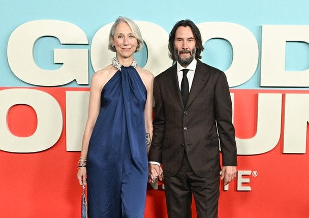 Keanu Reeves and Alexandra Grant on ice skates