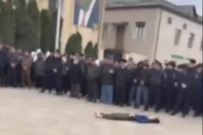 Emergency services inspect the body of the attacker on police officers