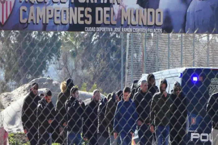 Sevilla fans throwing eggs at the bus