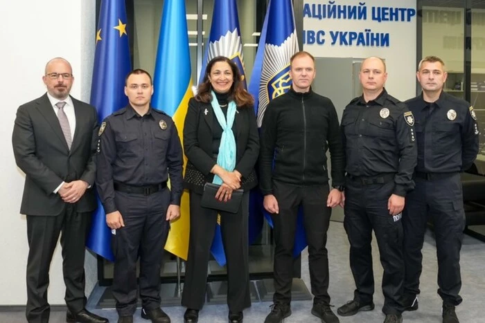 Representatives of the State Department with documents in hand