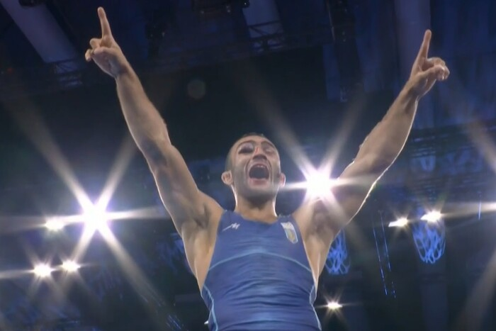 Wrestler Nasibov on podium with medal