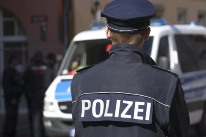 Police in masks guard the railway station