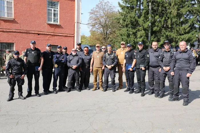 Group of Israeli police officers addressing violations in Uman