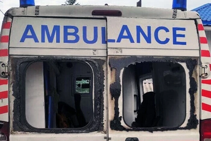 Ambulance car with signs of attack