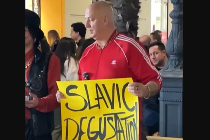 Potap with a poster and a bag