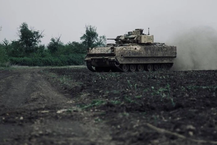 Tanks advancing on the village