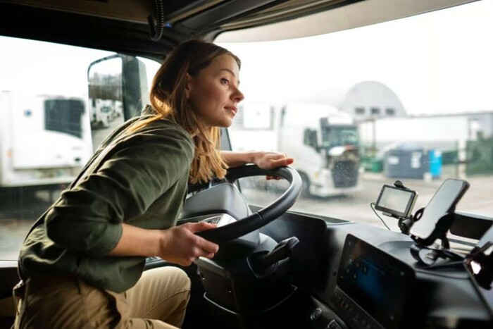 Woman driving a bus during training