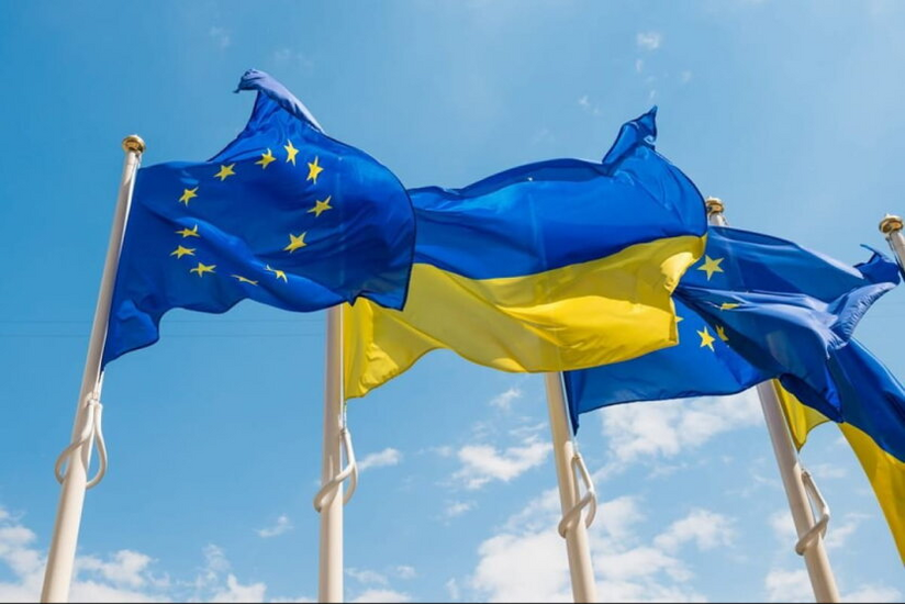 Flag of Ukraine with euro banknotes