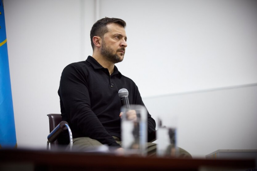 President Zelensky against the backdrop of the Ukrainian flag