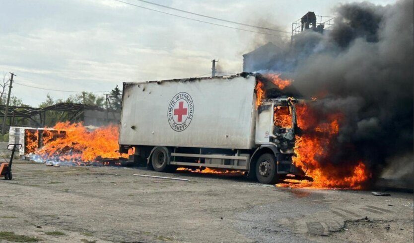 Red Cross humanitarian mission vehicle after being hit