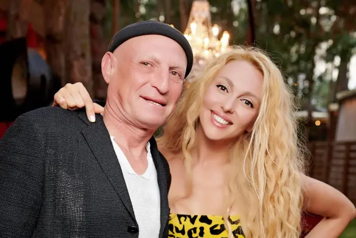Olya Polyakova with her blonde husband in bed
