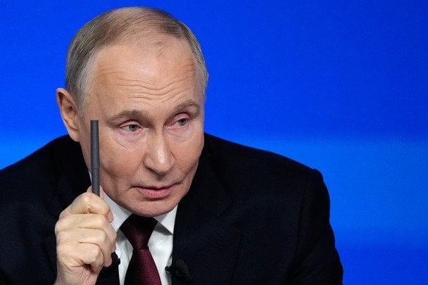 Путін за столом переговорів з картою