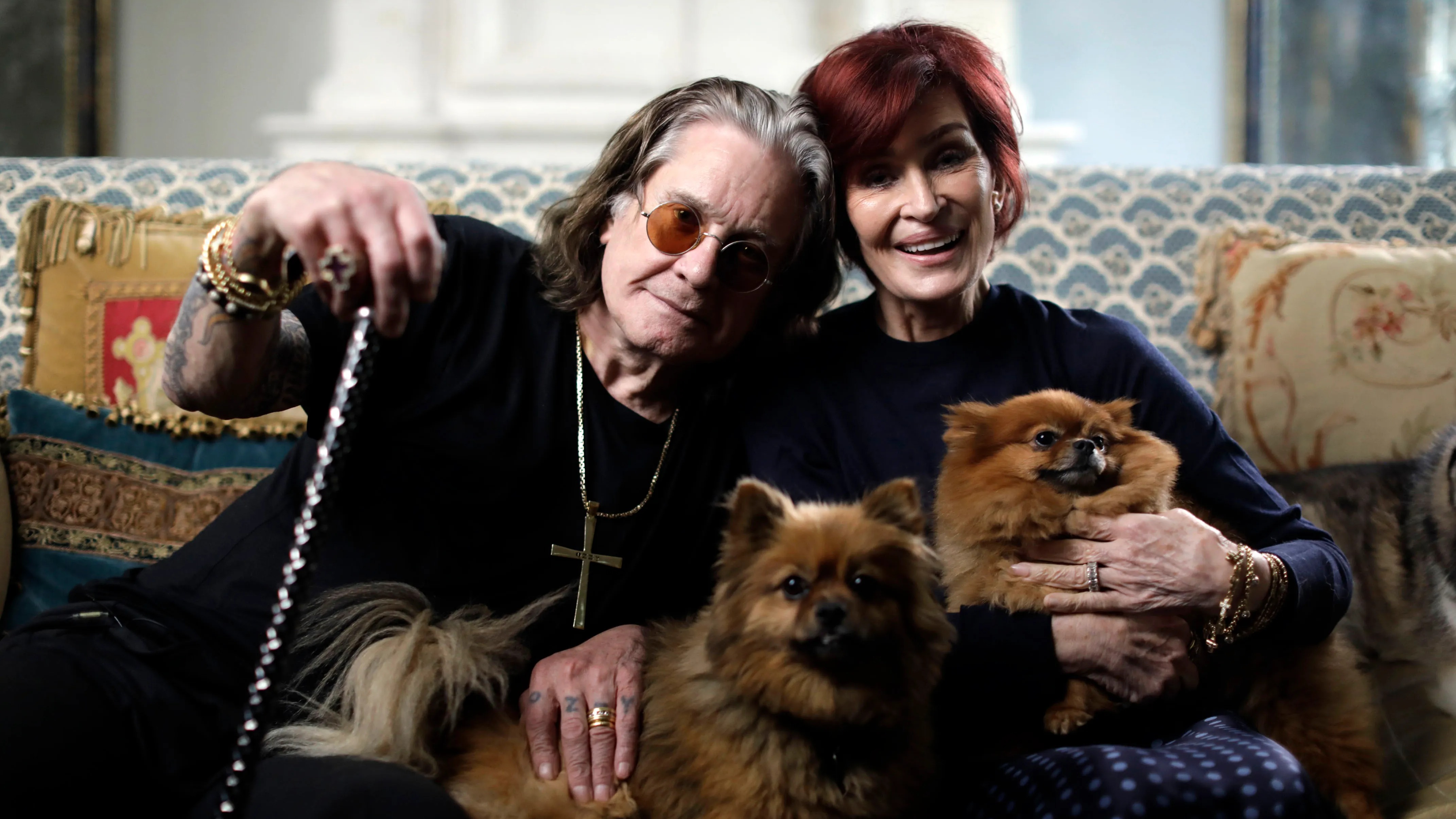 Ozzy Osbourne hugging his wife Sharon