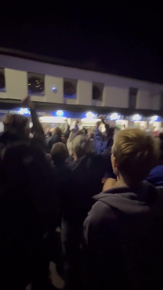 ‘Ultimate hate watch’ – Hundreds of rival fans watch TV through pub window to cheer on Grimsby in shootout vs Man Utd